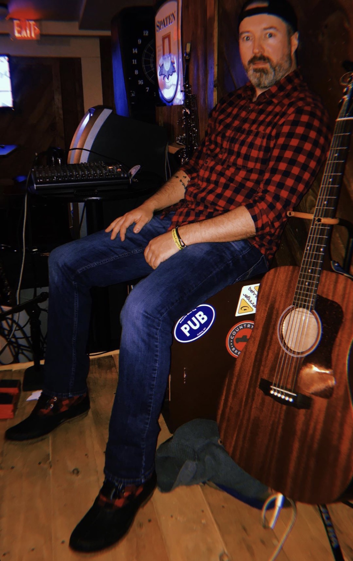 Kristofer Lee Bentley with acoustic guitar